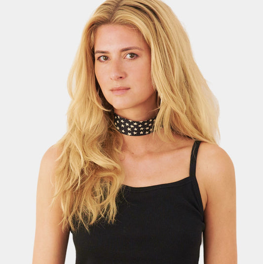 Model wearing a black silk choker with a star pattern