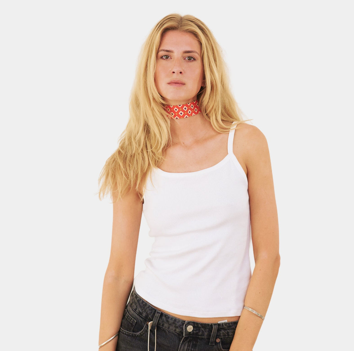 model wearing an orange silk choker with a geometric diamond pattern