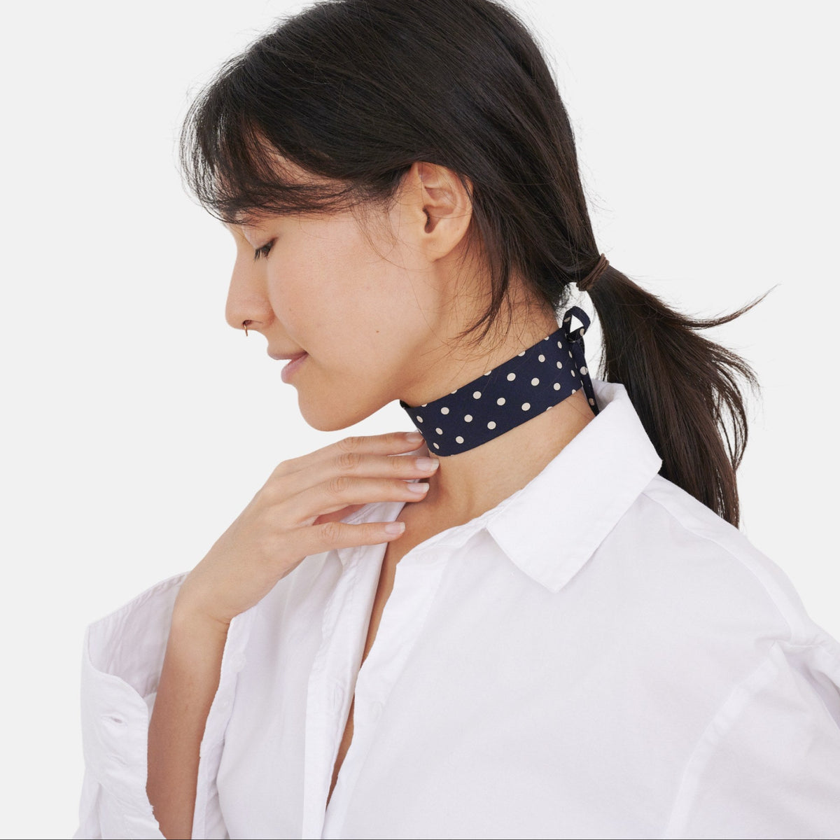 Model wearing the Navy Polka Dot Silk Choker – upcycled vintage silk tie | collo limited edition