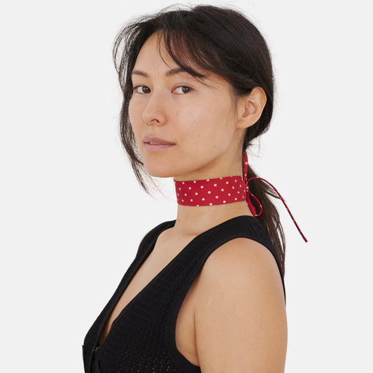 Model wearing the Red Polka Dot Silk Choker – upcycled vintage silk tie | collo limited edition