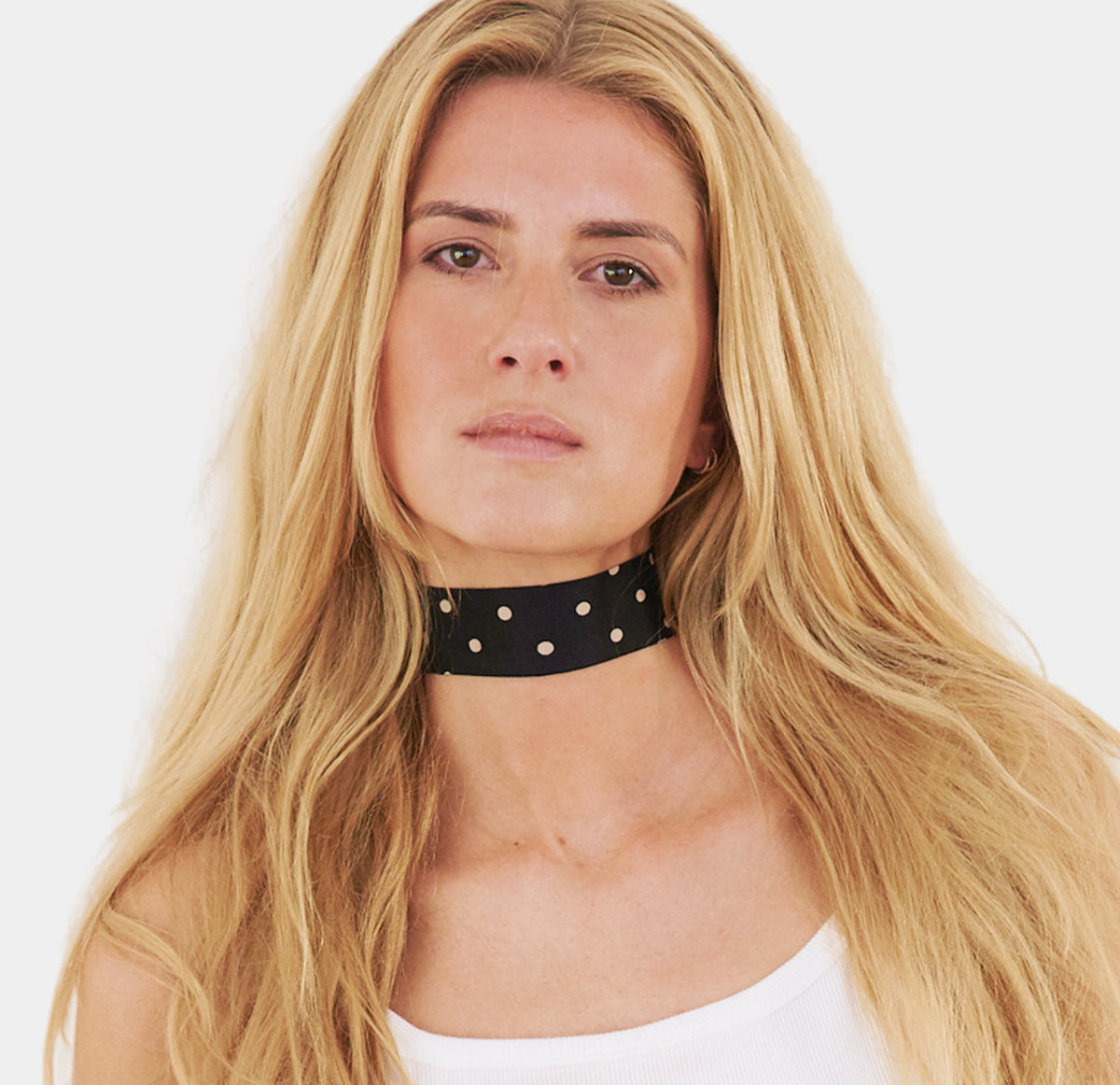 model wearing black polka dotted silk choker, collo limited edition 