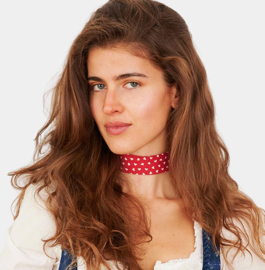 Model wearing red cotton choker with white hearts 