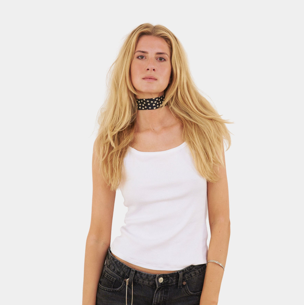 Model wearing a black silk choker with a star pattern