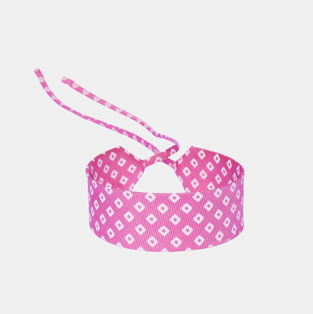 Pink silk choker with a repeating white diamond pattern