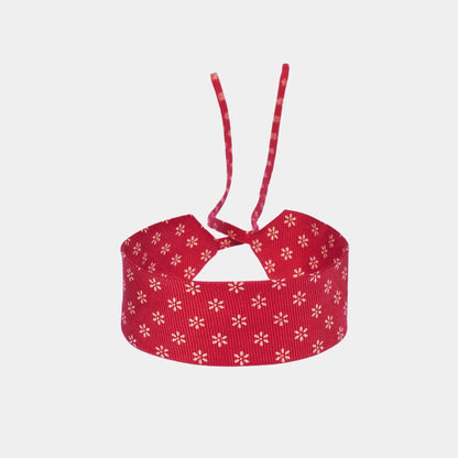 Red silk choker with a repeating white floral pattern