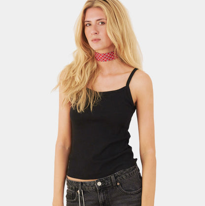 Model wearing a red silk choker with oval pattern