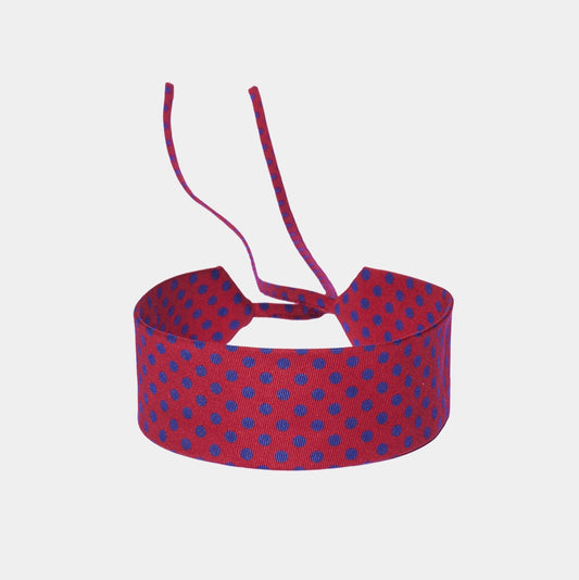 Scarlet red silk choker with a repeating blue polka dot pattern