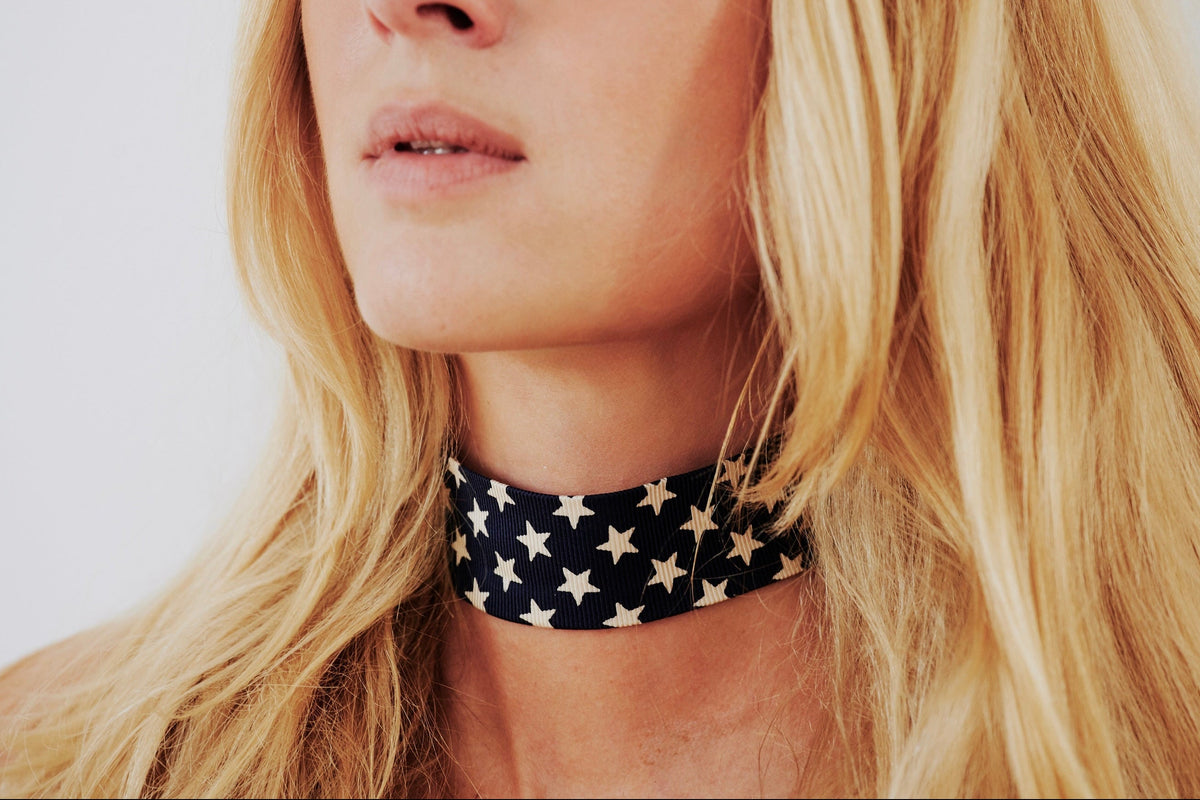 model wearing a black silk choker with star pattern