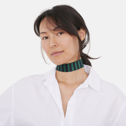 Model wearing the Blue & Green Striped Silk Choker – upcycled vintage silk tie | collo limited edition