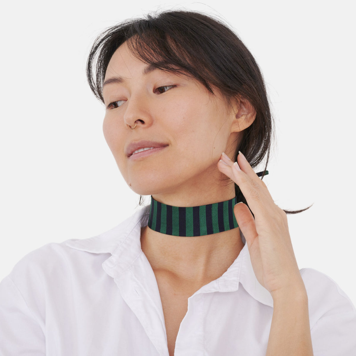 Model wearing the Blue & Green Striped Silk Choker – upcycled vintage silk tie | collo limited edition