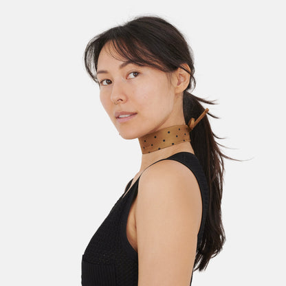 Model wearing the Golden Dotted Silk Choker – upcycled vintage silk tie | collo limited edition