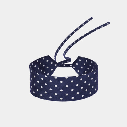 navy blue silk choker with a repeating white dot pattern