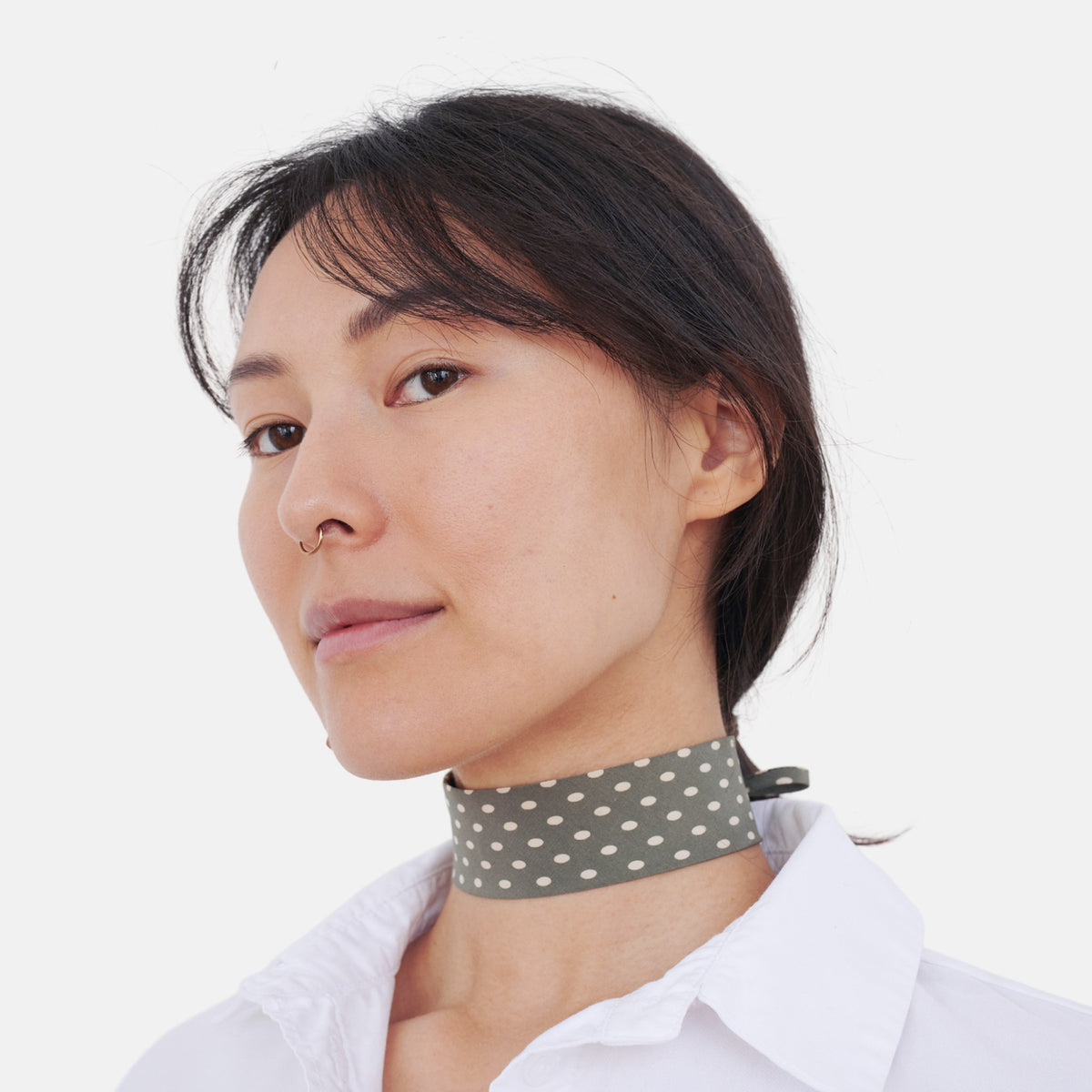 Model wearing the Sage Green Polka Dot Silk Choker – upcycled vintage silk tie | collo limited edition