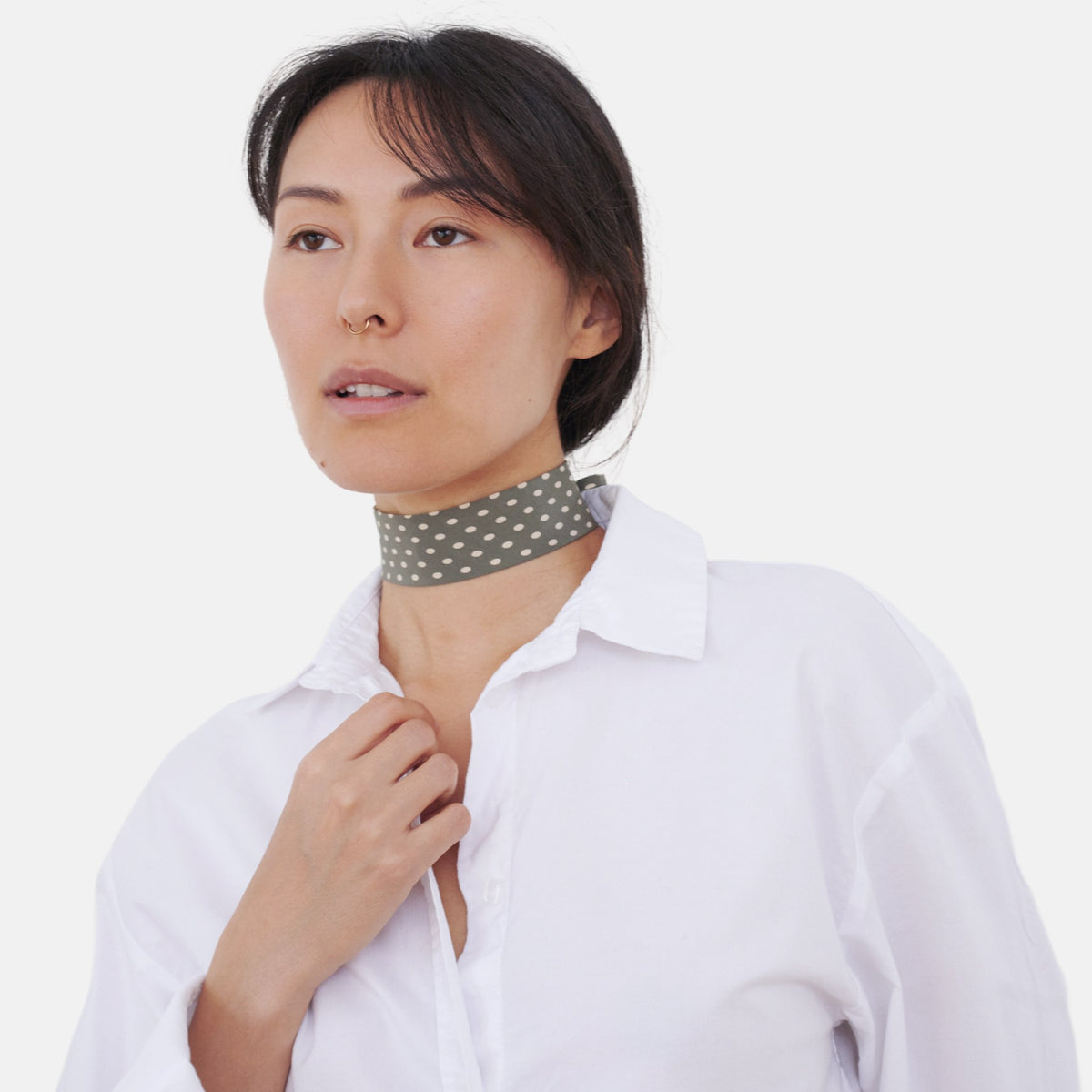 Model wearing the Sage Green Polka Dot Silk Choker – upcycled vintage silk tie | collo limited edition