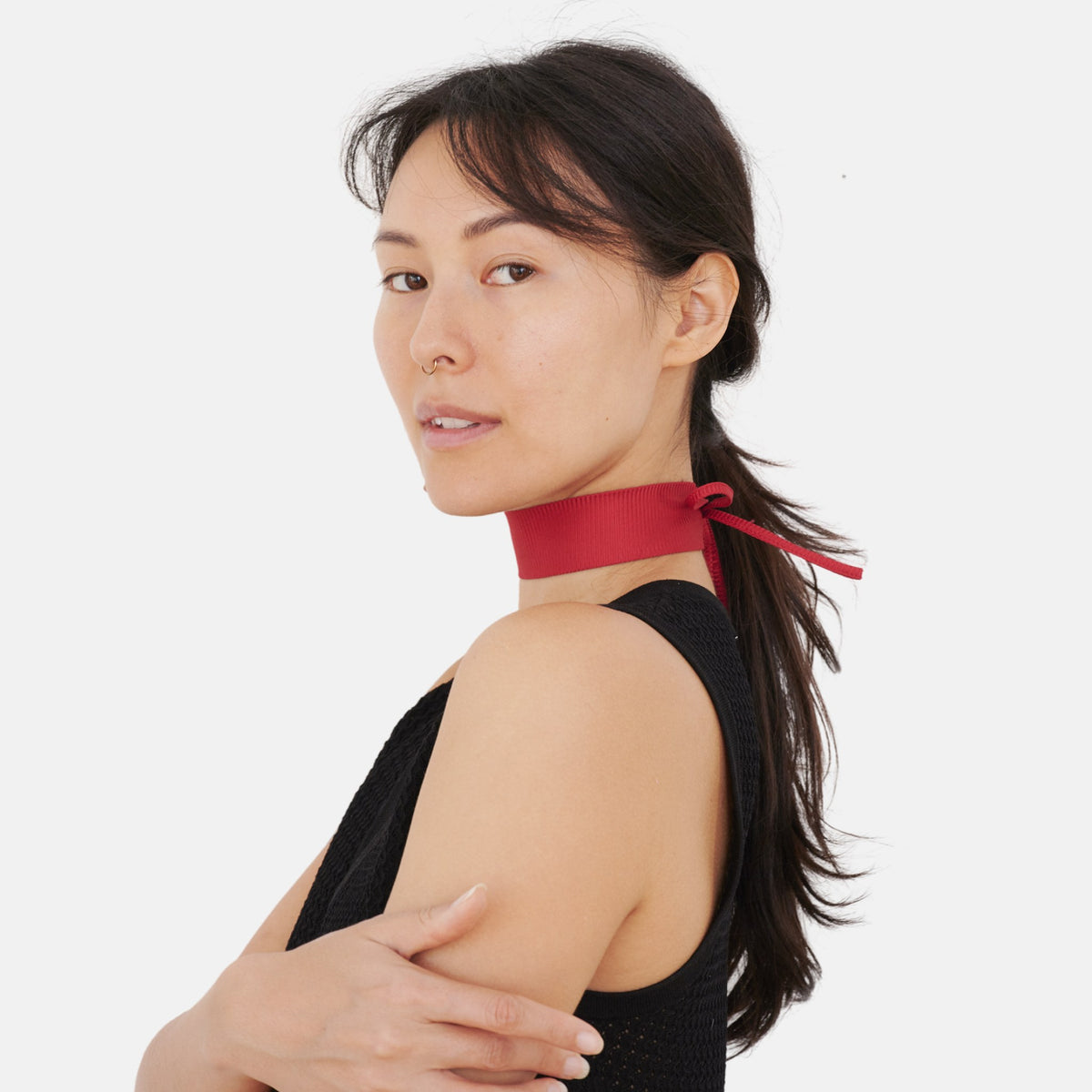 Model wearing the Solid Red Rib Silk Choker – upcycled vintage silk tie | collo limited edition