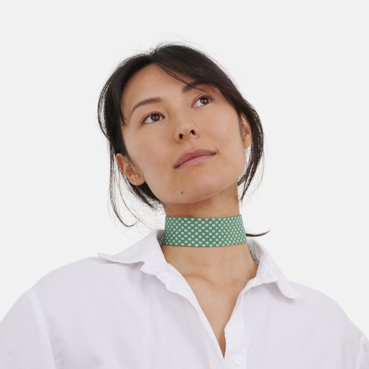 Model wearing the Teal Checkerboard Silk Choker – upcycled vintage silk tie | collo limited edition